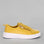 Naked Arches Nelly Mustard sneakers featuring mustard yellow color, lace-up design, and casual athletic style.