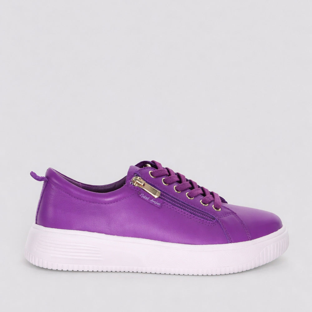 Naked Arches Nelly Purple sneakers featuring purple and white design, casual athletic footwear with stylish laces and cushioned sole.
