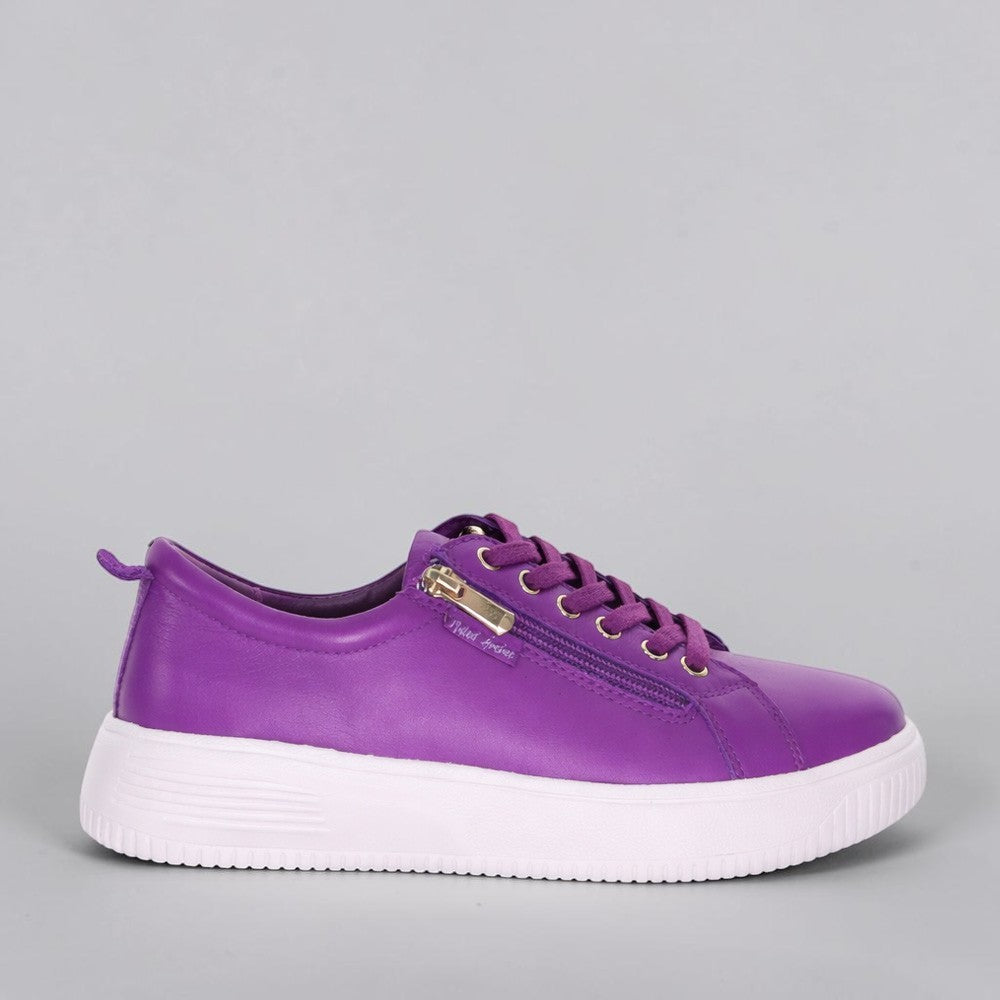Pink and purple NAKED ARCHES NELLY sneakers with textured sole and stylish design, shown on a white background.