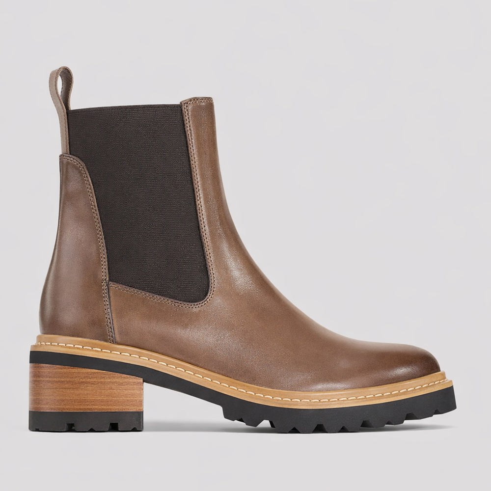 Eos EOS Linear Nocciola boots in brown leather with ankle height and sleek design, shown on a model.