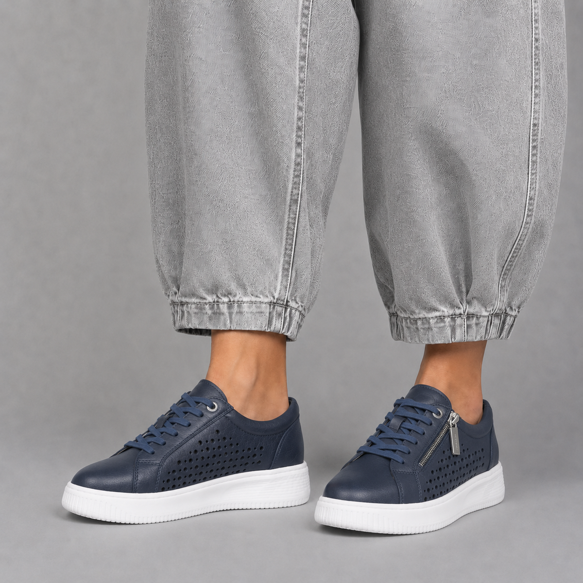 Naked Arches Noble Navy sneakers with navy blue upper, white sole, and sleek design, showcasing comfort and modern style.