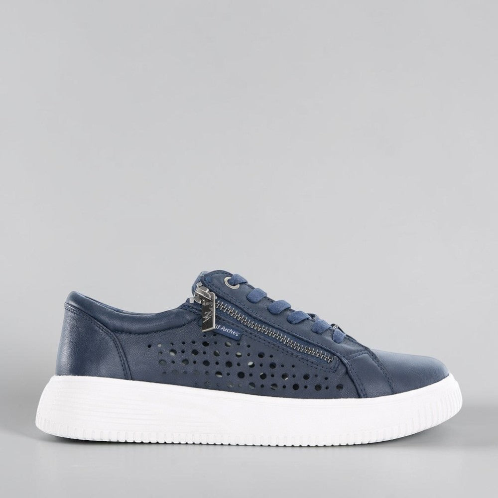 NAKED ARCHES Noble Navy sneakers showing navy blue canvas shoes with white soles and laces, stylish and casual footwear.