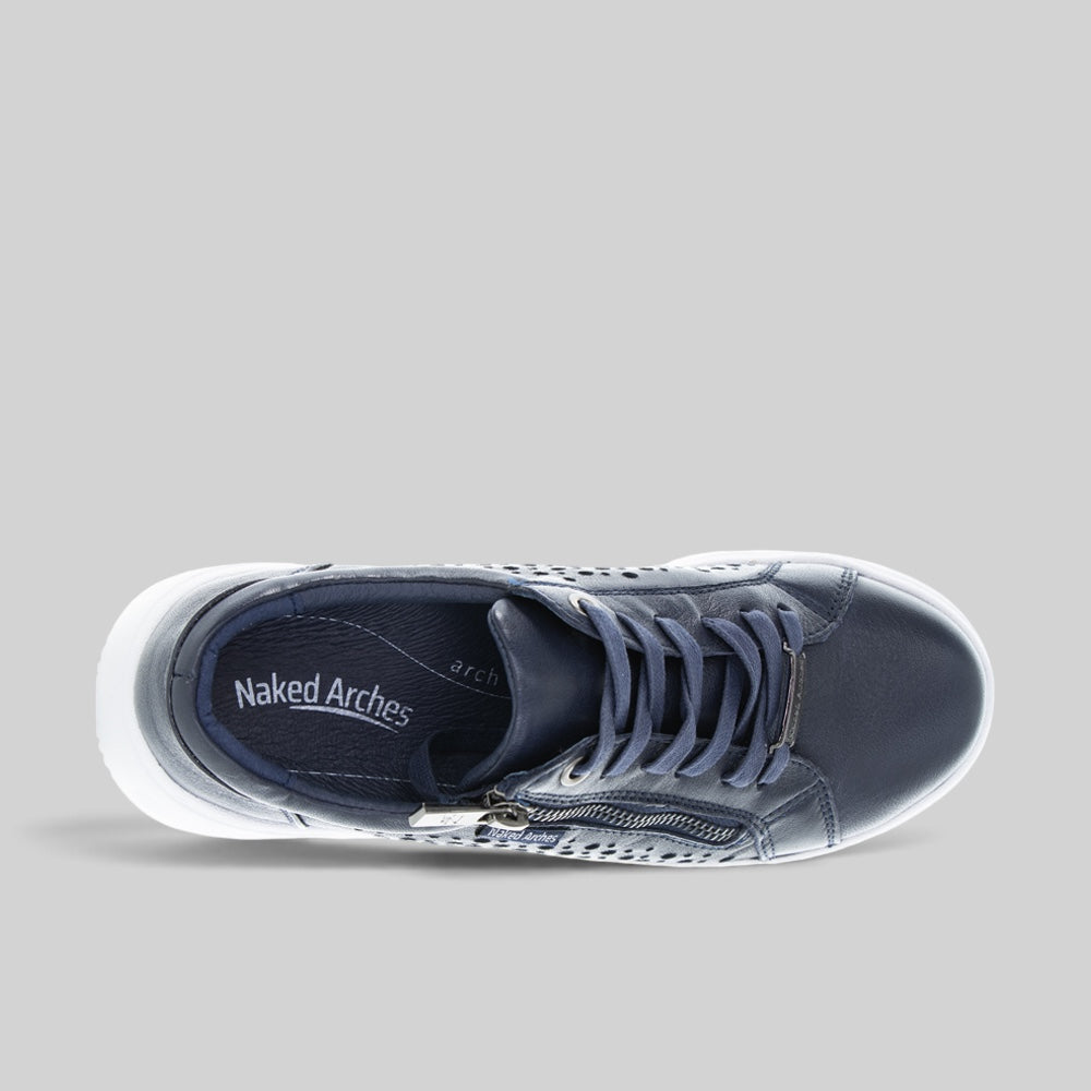Naked Arches Noble Navy sneakers with navy blue and white accents, casual slip-on design, and cushioned sole.