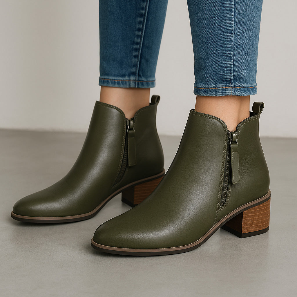 Le Sansa Oxley olive boots with ankle-high design and lace-up closure, featuring a sleek, stylish look in olive green.