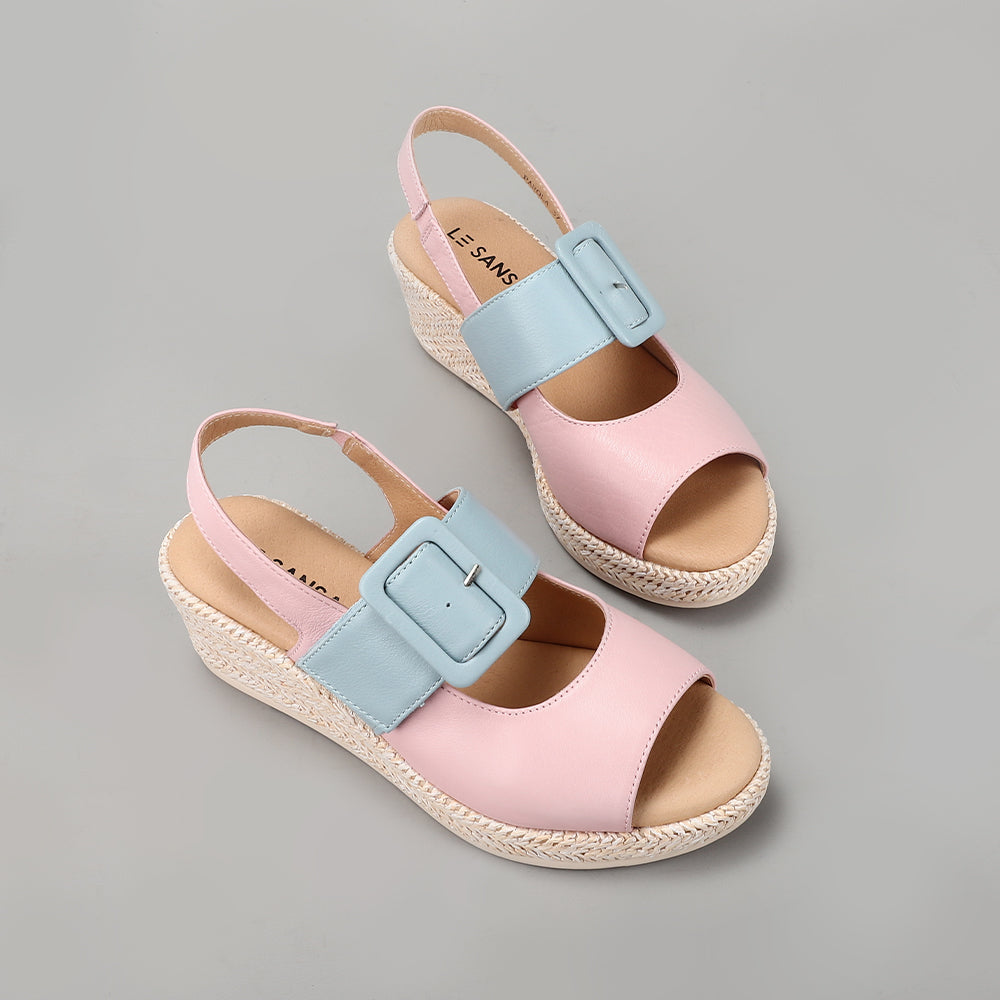 Le Sansa Parola pink blossom and baby blue sandals featuring floral details and open-toe design on light-colored background.