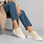 Beige LE SANSA Quinn sneakers with white soles and sleek design, perfect for casual and stylish everyday wear.