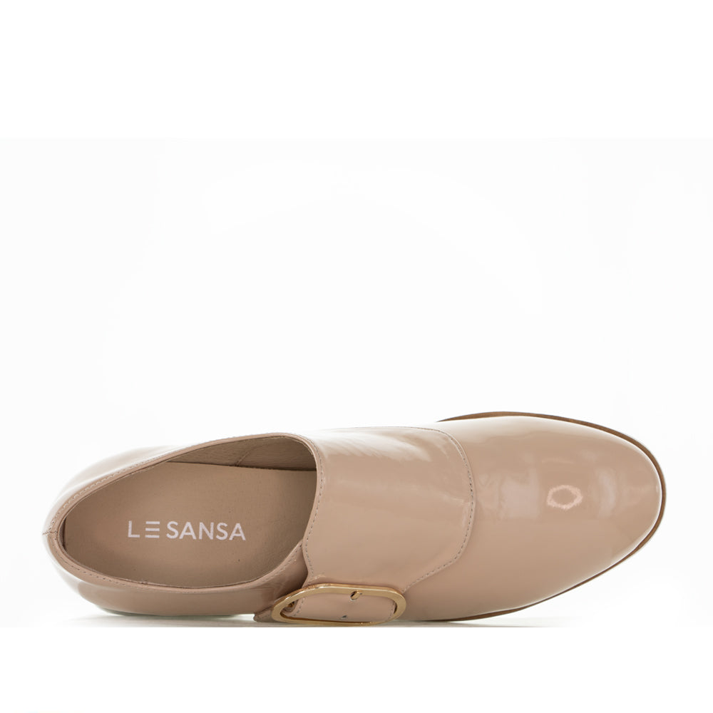 Le Sansa Rice Blush Patent loafers with sleek design and glossy finish, showcased on a neutral background.