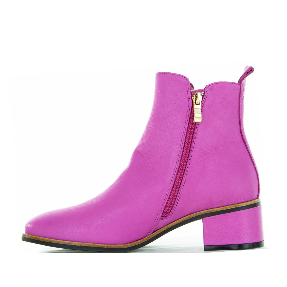 Le Sansa Hot Pink Ring Boots featuring vibrant pink leather and stylish design, perfect for bold fashion statements.