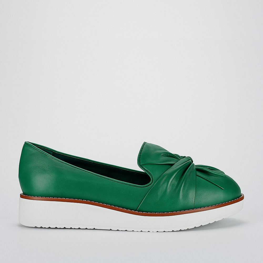 LE SANSA Rosie Pine slip-on shoes with floral design, featuring comfortable fabric and casual style.