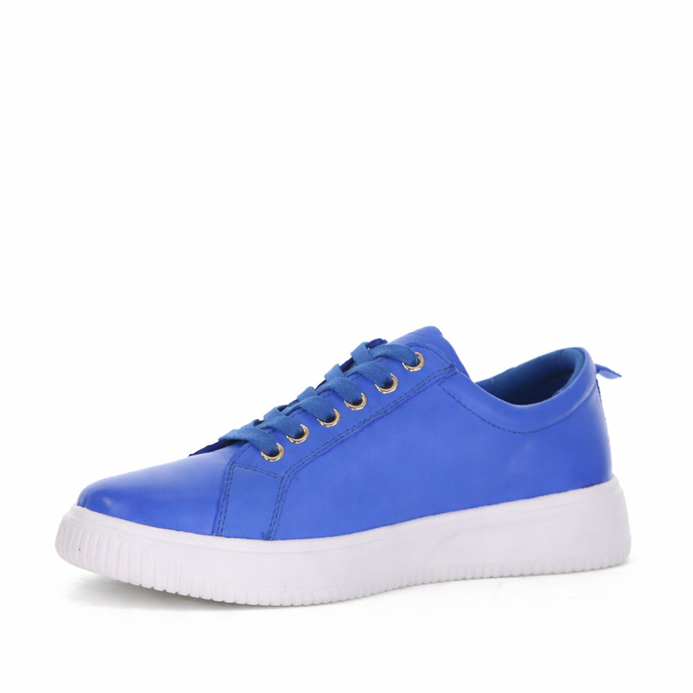 Royal blue Naked Arches Nelly sneakers with white accents, showcasing the stylish, comfortable design of the casual footwear.