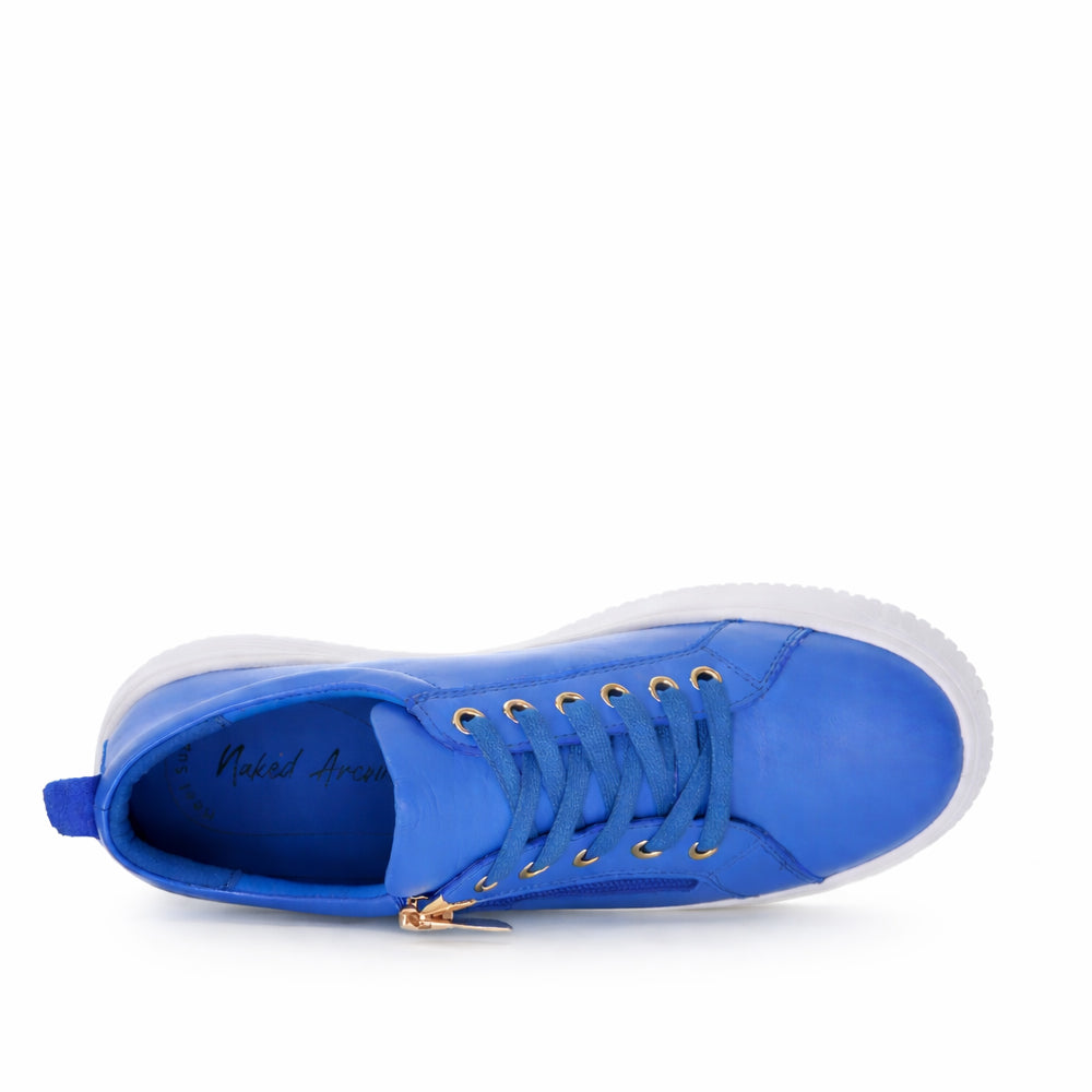 Naked Arches Nelly Royal Blue sneakers with white soles and laces, featuring a sleek design and vibrant blue color.