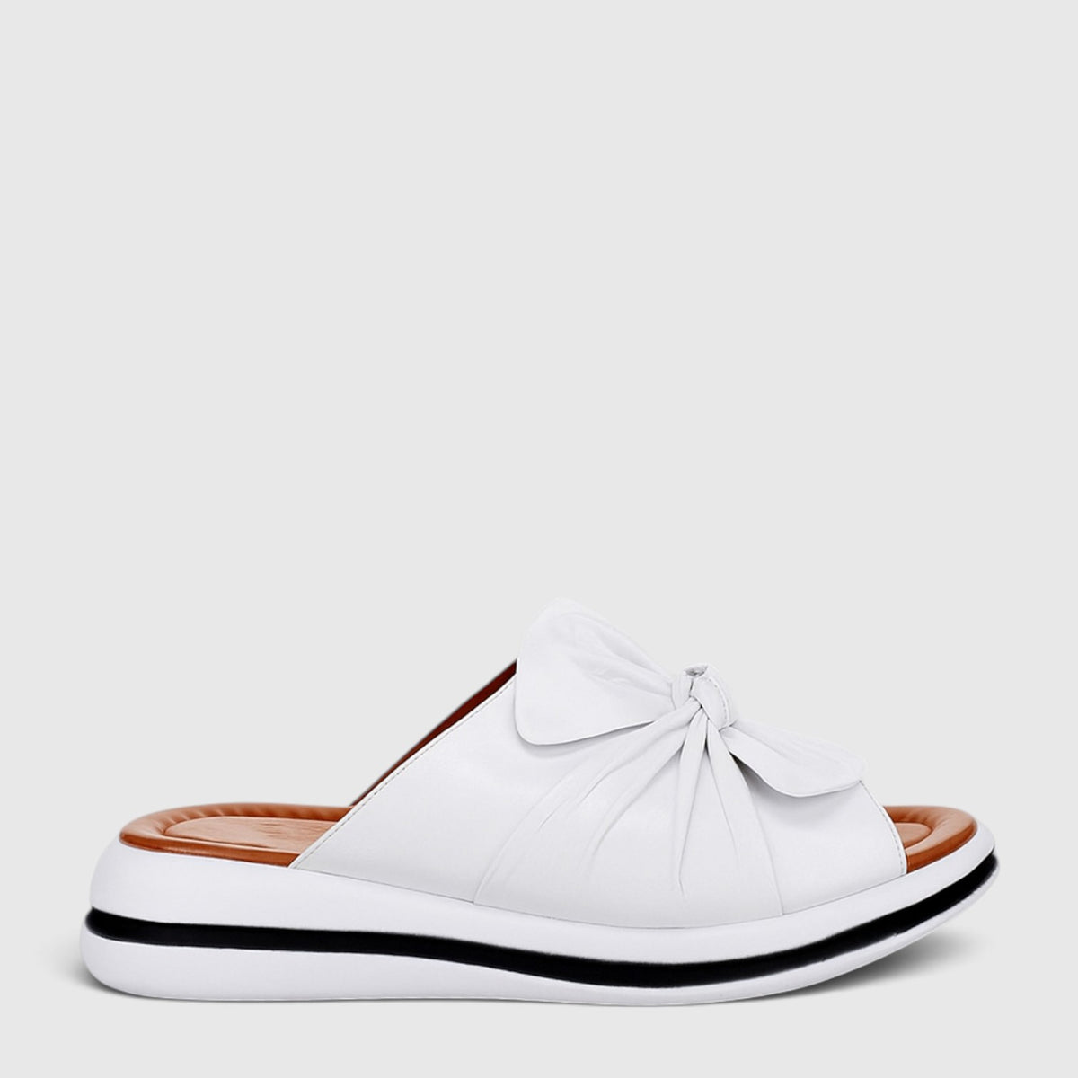 Le Sansa flats in white, showcasing their sleek and comfortable design with a smooth finish and minimalist style.