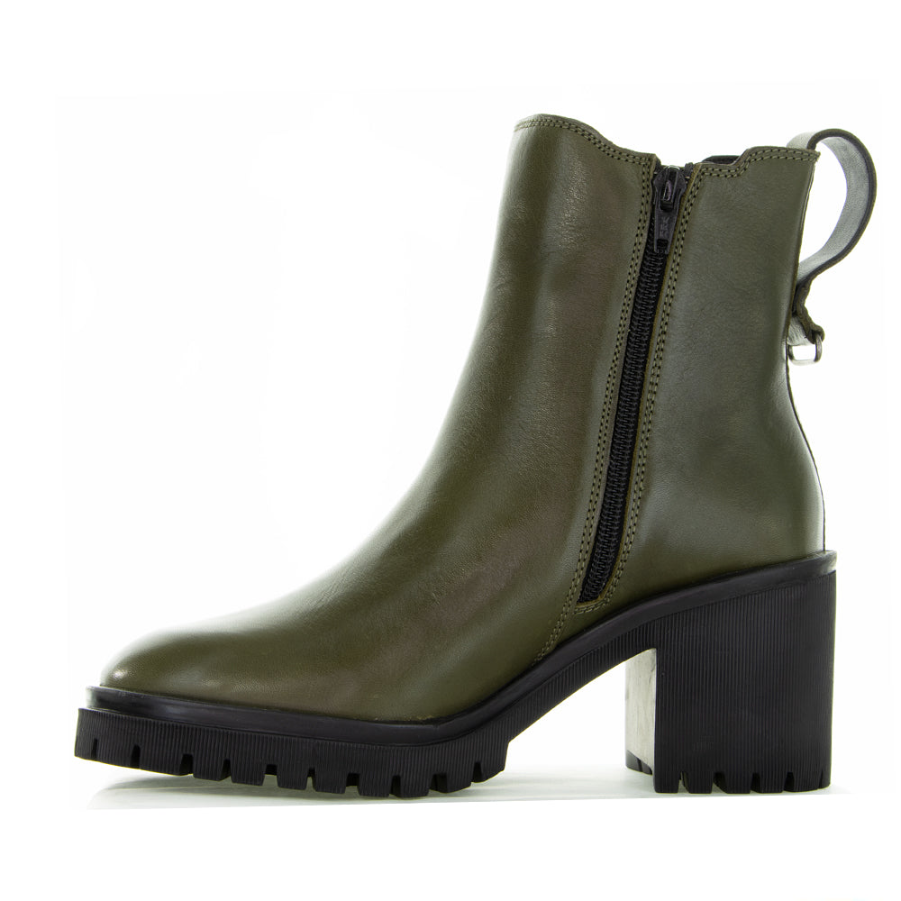 Le Sansa Samira Olive boots displayed on a model, showcasing their stylish design and olive green color.