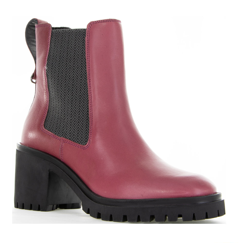 Le Sansa Samira hot pink boots with ankle-high design and stylish silhouette, shown in a close-up view.