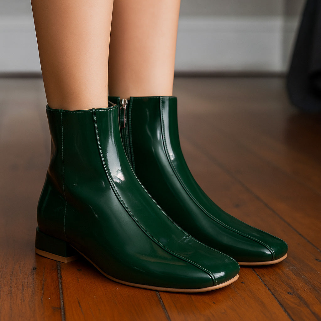 Le Sansa Sasha green boots with ankle-high design and stylish silhouette, perfect for casual and chic outfits.