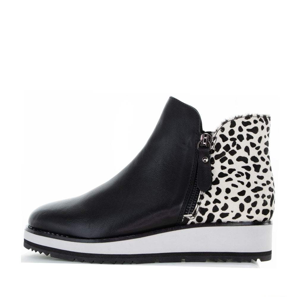 Black LESANSA Stow Snow Pony boots with rugged soles and stylish design, perfect for winter outdoor wear.