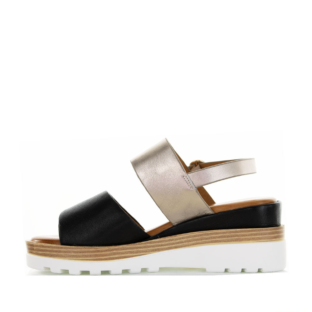 Le Sansa Tess Black Champagne sandals with stylish straps and a chic design, perfect for summer or casual wear.