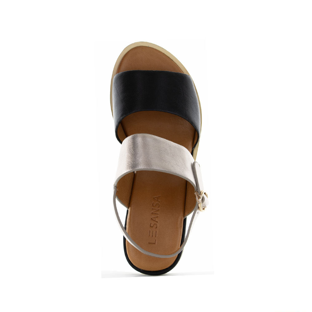 Le Sansa Tess Black Champagne sandals with elegant straps and a sleek design, perfect for stylish summer wear.