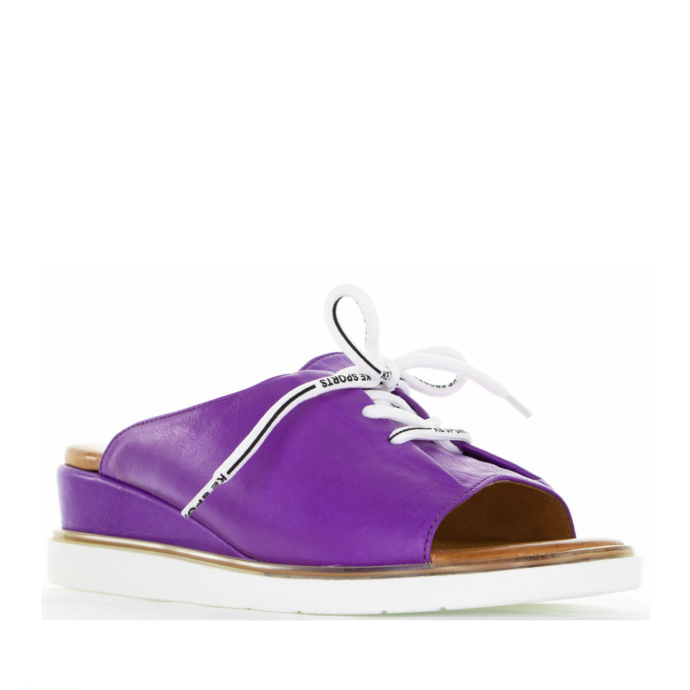 Le Sansa Lesansa Tinny Purple slip-on shoes with vibrant purple fabric and casual design for comfortable everyday wear.