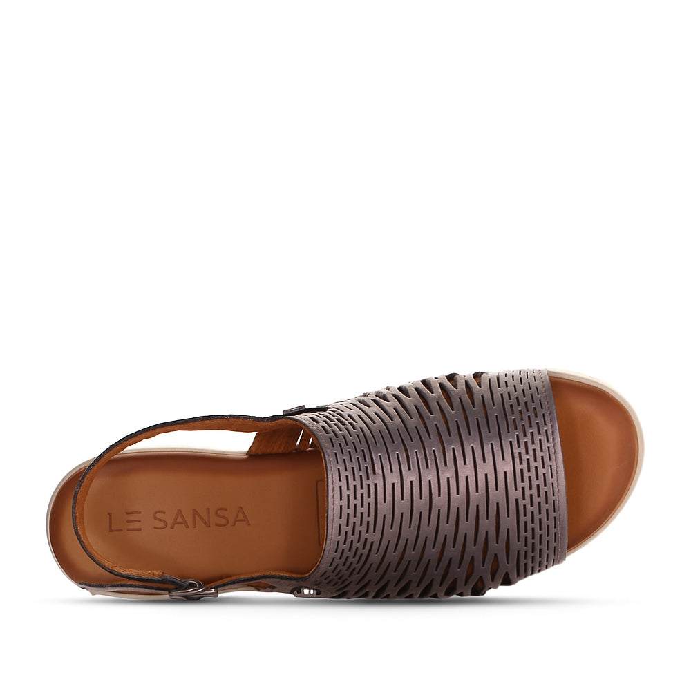 Le Sansa Topaz Pewter sandals with metallic finish and open toe, featuring sleek straps and comfortable flat sole.