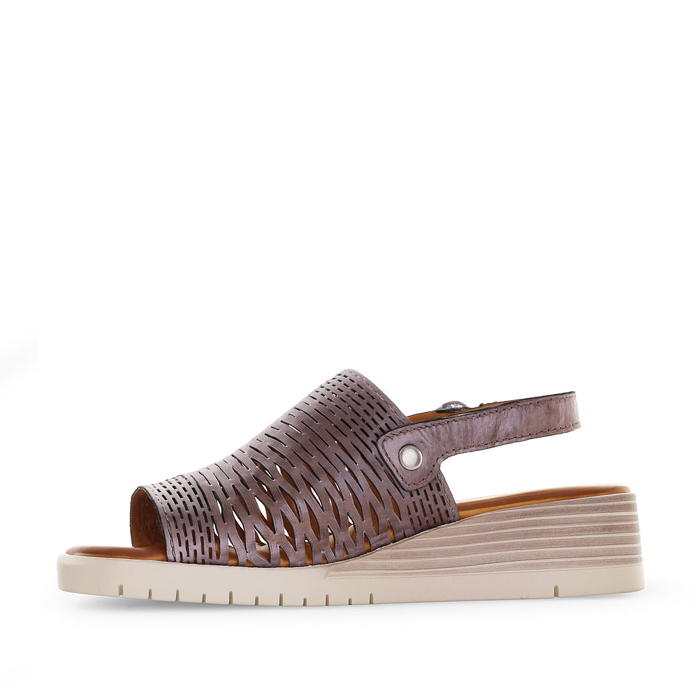 Le Sansa Topaz Pewter sandals featuring metallic finish, open toe design, and ankle strap for casual and stylish wear.