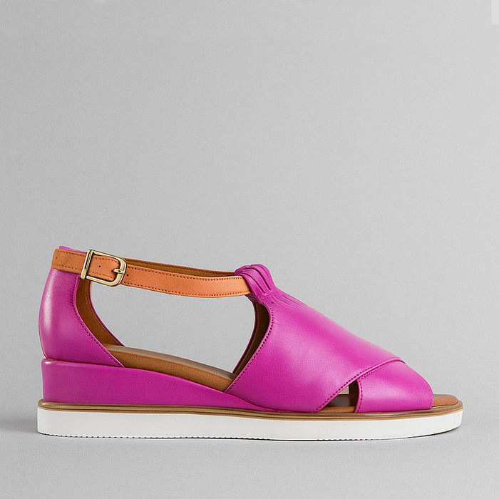 Le Sansa Tosca Hot Pink Tan sandals with stylish straps and open toe design on neutral background