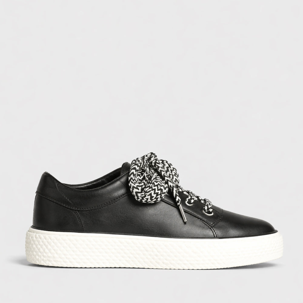 Eos Trinsic Black sneakers with sleek design, black upper, and white sole, casual athletic footwear for everyday wear.