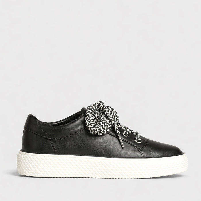 Eos Trinsic Black sneakers with sleek design, black upper, and white sole, casual athletic footwear for everyday wear.