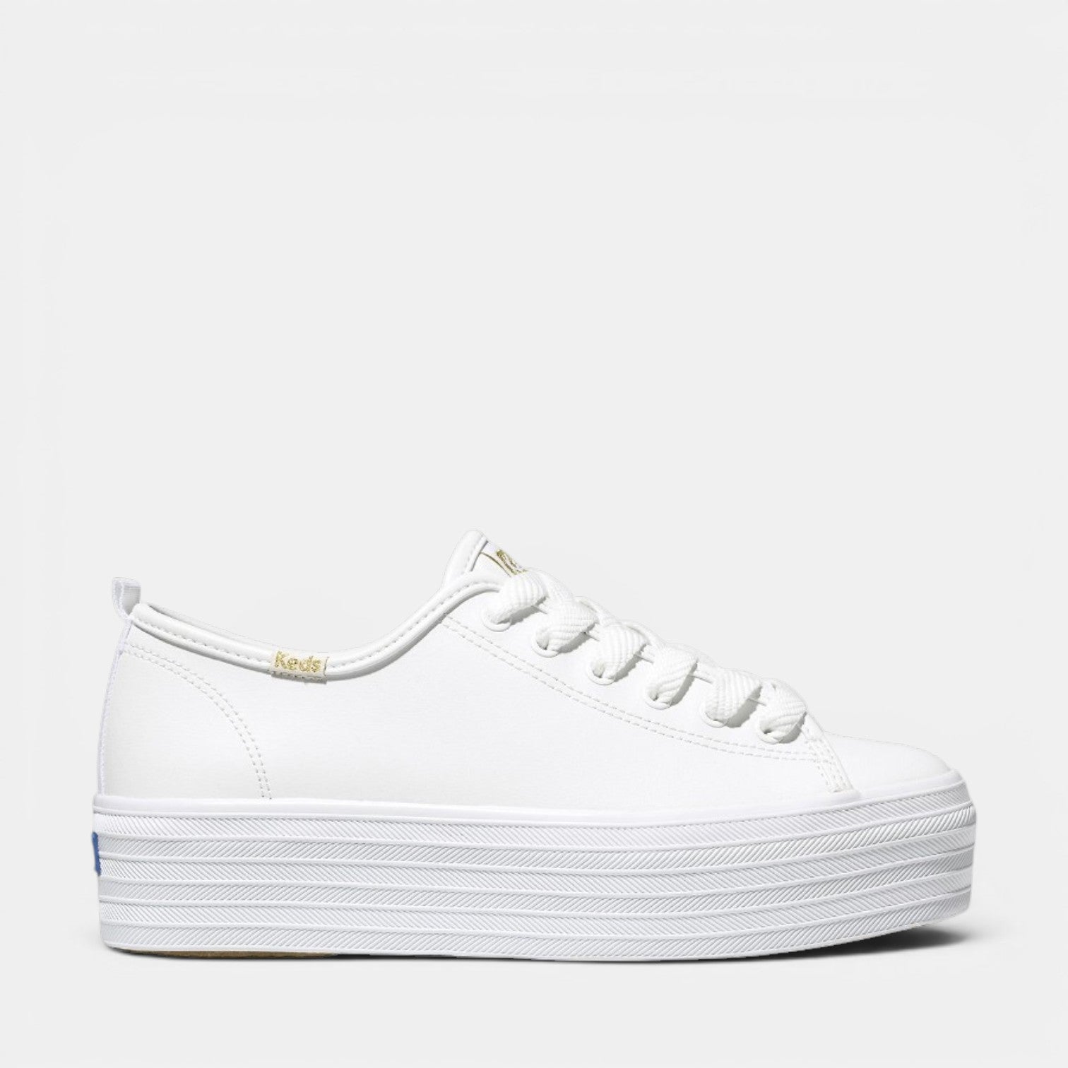 KEDS Triple Up White casual sneakers featuring a white canvas upper and white rubber sole, styled for everyday wear.