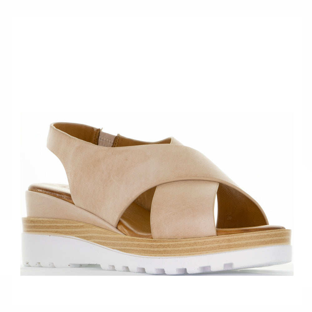 LE SANSA Trisha Blush sandals featuring soft blush-colored straps and a comfortable flat sole.