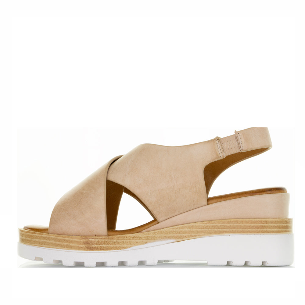 Le Sansa Trisha Blush sandals in soft pink with strappy design and flat sole, perfect for casual summer wear.