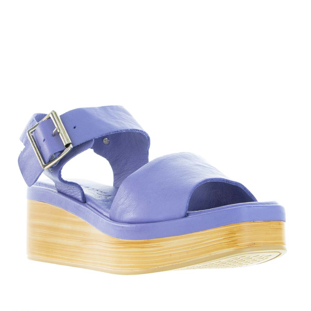 Le Sansa True Purple sandals with open toes and ankle straps, featuring a stylish purple leather design.