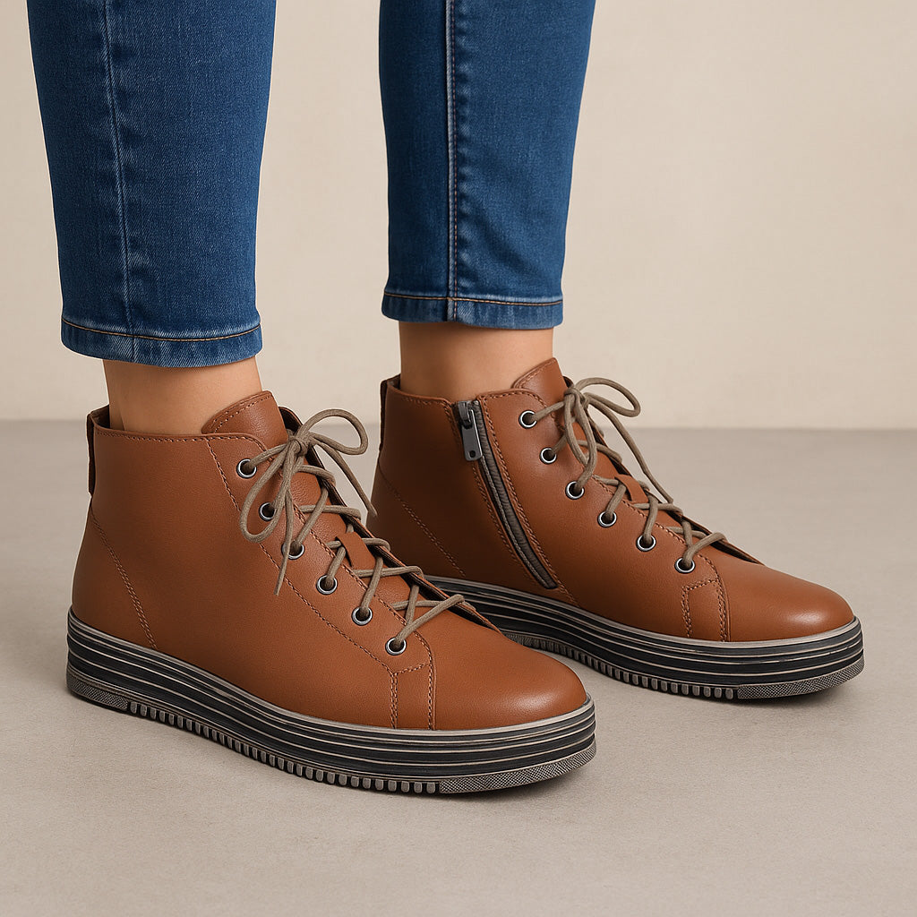 Le Sansa Vivid Tan boots featuring sleek leather design and stylish ankle-high cut, perfect for casual or dressy outfits.