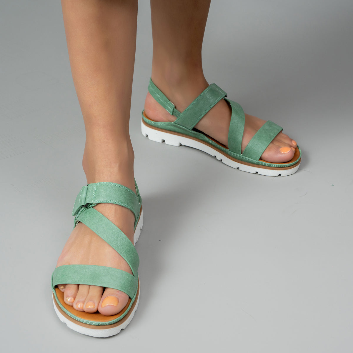VS Treads Yaryna Mint sandals featuring a stylish design with mint green straps and comfortable flat soles.