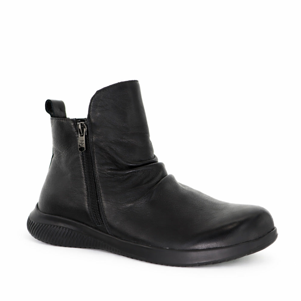 Black NAKED ARCHES YILA boots with a sleek design, featuring pointed toes and stiletto heels, displayed on a neutral background.