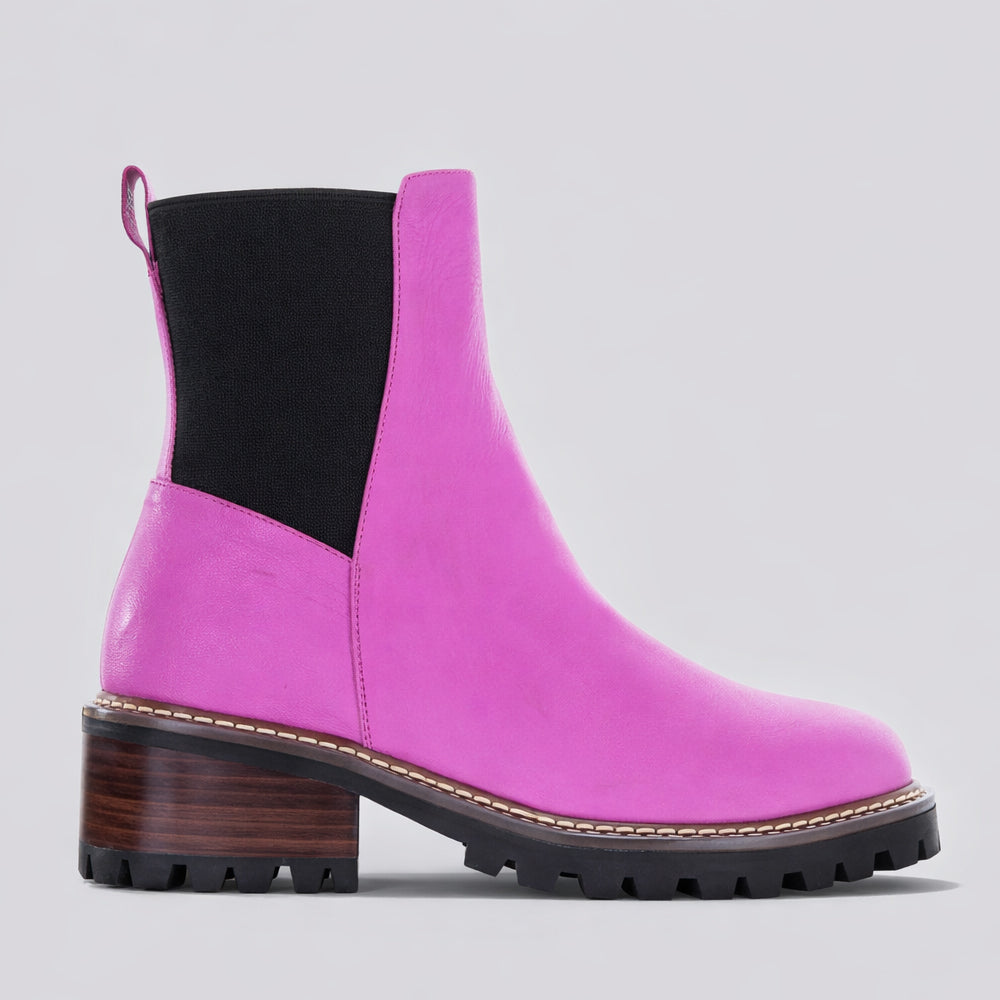 LE SANSA Zina hot pink boots with stylish design and chunky heel, perfect for trendy fashion statements.
