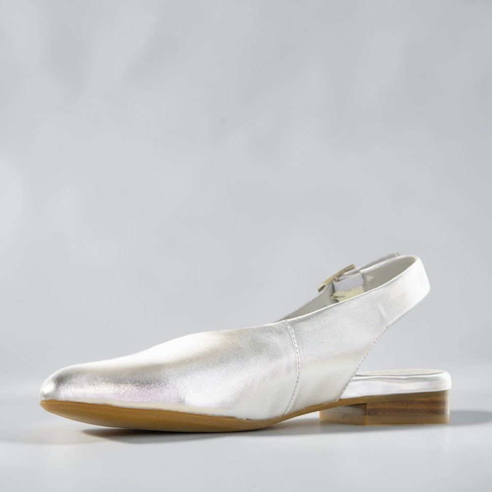 Silver Zodiac Sandals by Naked Arches featuring intricate zodiac-inspired designs on the straps and footbed.