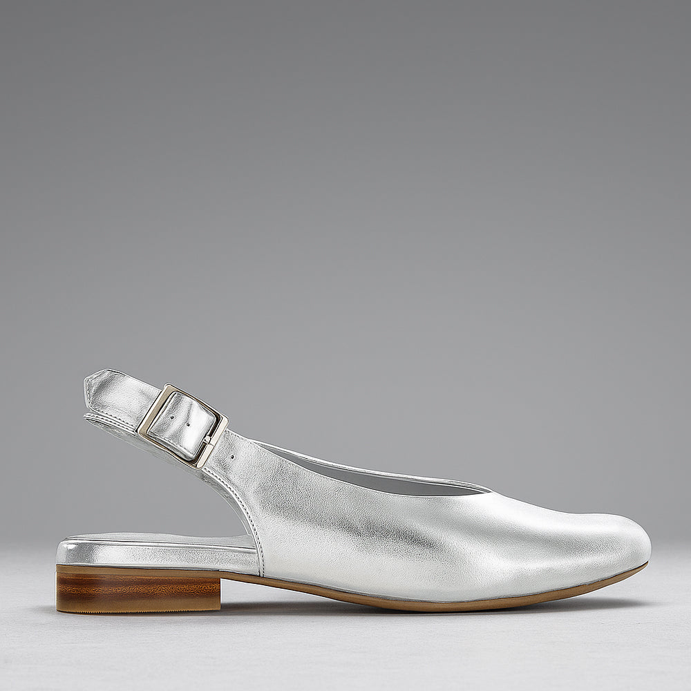 Naked Arches Zodiac Silver sandals with zodiac-themed silver embellishments and open-toe design, casual footwear for warm weather.