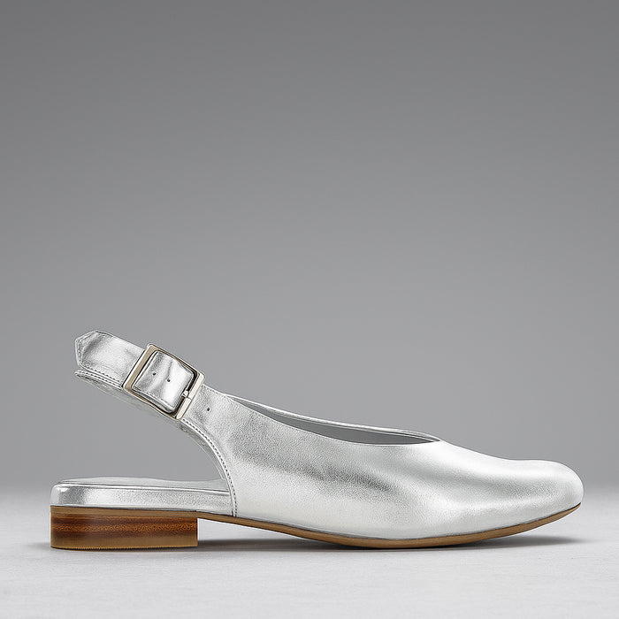 Naked Arches Zodiac Silver sandals featuring metallic silver straps with zodiac-themed designs and adjustable ankle straps.