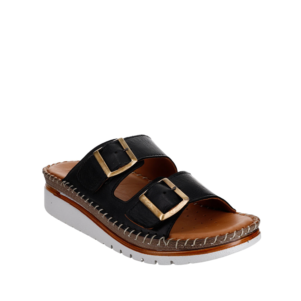 Black Le Sansa Freya slip-on shoes with sleek design and comfortable fit, shown on a plain background.