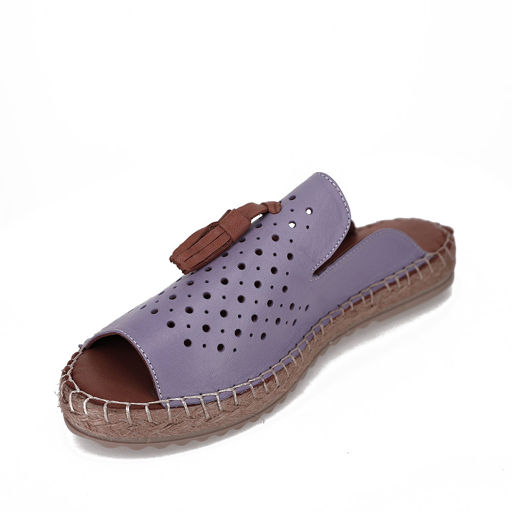 Le Sansa slip-on shoes in lavender with a comfortable, casual design and soft fabric upper.