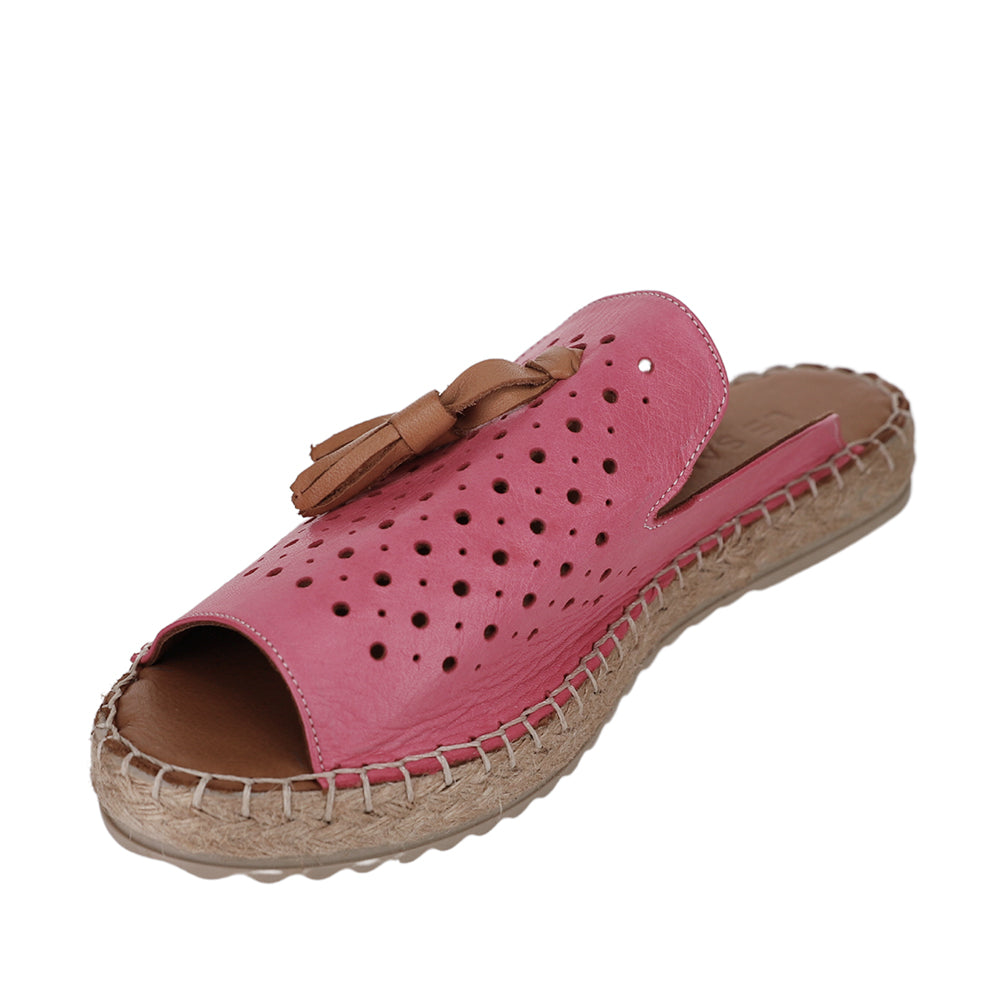 Le Sansa slip-on shoes in fuchsia with a sleek, rounded design and comfortable fabric upper, displayed on a plain background.