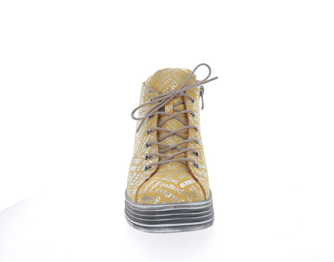 Le Sansa Vivid Mustard Print boots with bold pattern, stylish ankle-length leather footwear with decorative stitching.