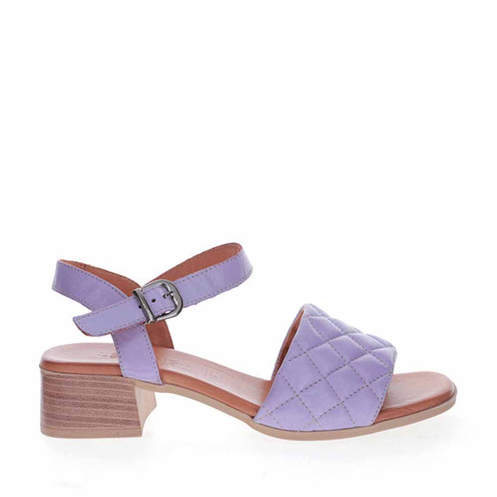 Le Sansa Lincoln Lilac sandals with open toes and ankle straps, featuring a soft lilac color and stylish design.