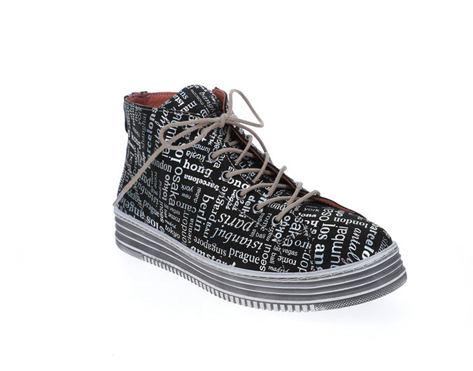 Le Sansa Vivid Black Print boots featuring bold black and vibrant pattern, stylish footwear with intricate design details.