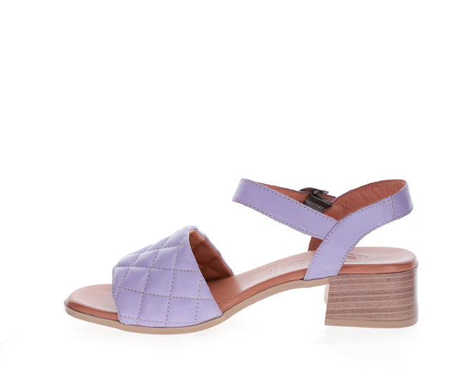 Le Sansa Lincoln Lilac sandals with open toe design and ankle strap, featuring soft lilac-colored straps and comfortable sole.