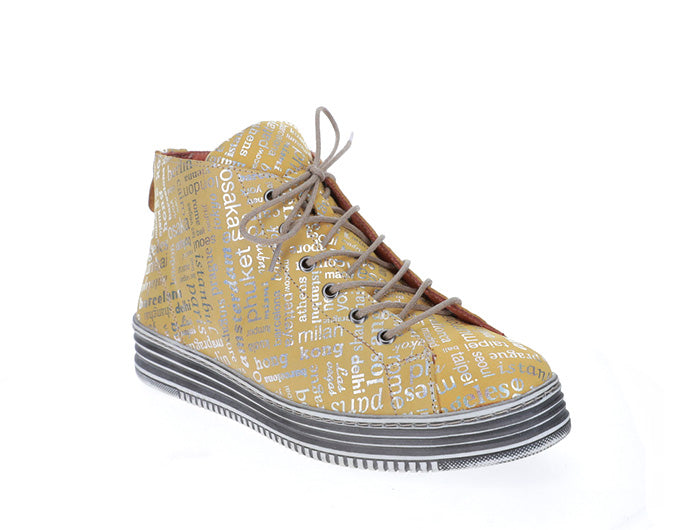 Le Sansa Vivid Mustard Print boots with bold pattern and ankle-high design, featuring a sleek silhouette and stylish heel.