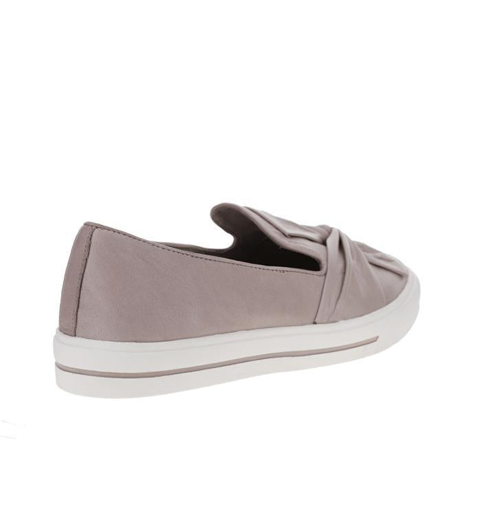 Le Sansa Izzy silver grey slip-on shoes showing a sleek, minimalist design with smooth fabric upper and comfortable fit.