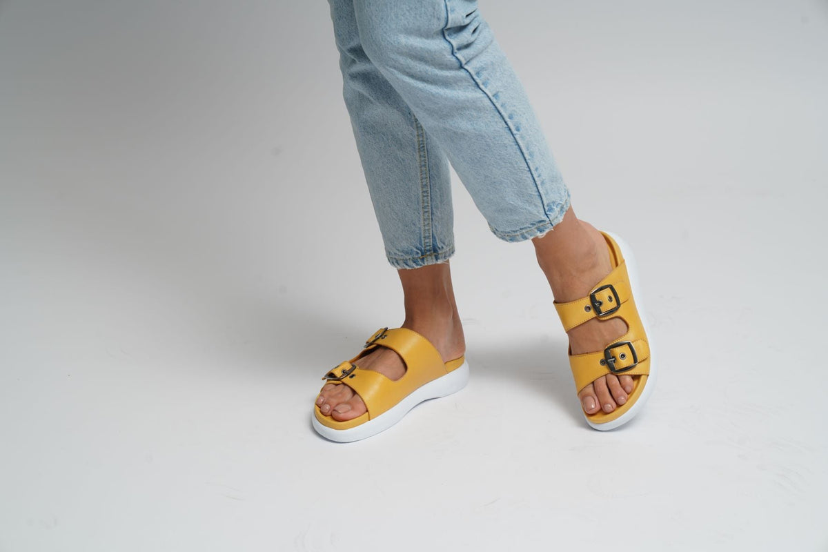 Lesansa Burma Mustard casual shoes in black leather with tan accents, featuring a rounded toe and lace-up design.