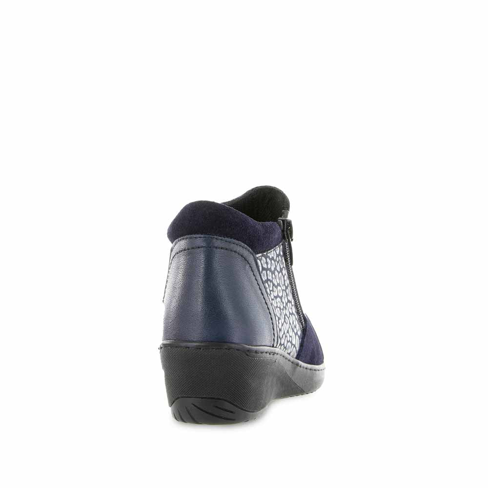 Navy Cabello CP462-18 boots with sturdy sole and stylish design, showcasing a close-up of the fashionable footwear.